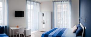 Posteľ alebo postele v izbe v ubytovaní Carducci Bistrot
