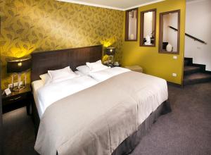 Postel nebo postele na pokoji v ubytování Boutique-Hotel Moseltor