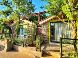 a house with a fence in front of it at Leda Beach Hotel in Side