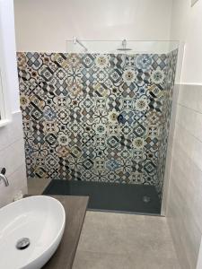 Koupelna v ubytování Minioto Rooms