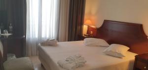 Uma cama ou camas num quarto em Hotel Apollonia Delphi