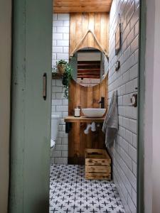 a bathroom with a sink and a mirror at Masia Sisqueta in Els Muntells