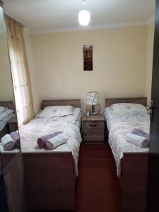 Uma cama ou camas num quarto em Guest House Nanu