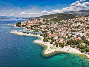 an aerial view of a small island in the water at Apartman Mirno More in Selce