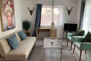 a living room with a couch and a table at The Bungalow in Chesterton