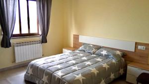 Posteľ alebo postele v izbe v ubytovaní La Villa Hostal
