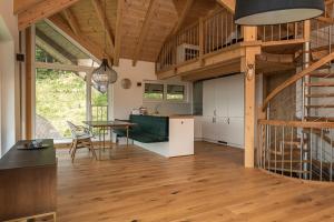 a kitchen and dining room with a wooden ceiling at Forsthaus Gray 4 in Sankt Veit an der Glan