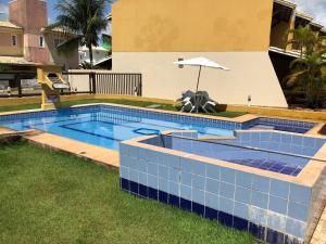 Bazén v ubytování Guarajuba - BA - Confortável casa com 3 quartos, 2 suites nebo v jeho okolí