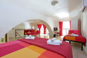 a bedroom with two beds and a living room at Lucky Holidays in Rome