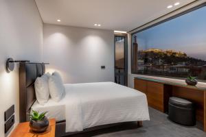Postel nebo postele na pokoji v ubytování Amazon Hotel