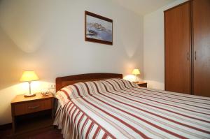Postel nebo postele na pokoji v ubytování Hotel Rosina