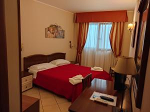 Postel nebo postele na pokoji v ubytování Greta Rooms Hotel