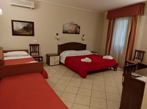 Postel nebo postele na pokoji v ubytování Greta Rooms Hotel + 31 fotografií