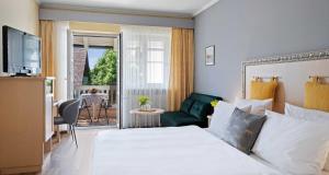 Postel nebo postele na pokoji v ubytování Hotel St Leonhard
