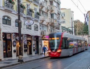 a train is traveling down a city street at Orient Express & Spa by Orka Hotels in Istanbul