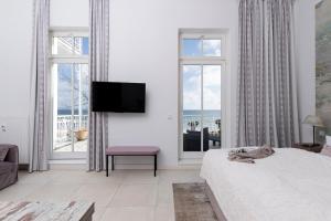 Μια τηλεόραση ή/και κέντρο ψυχαγωγίας στο Appartementhaus Bellevue Binz