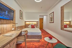 Postel nebo postele na pokoji v ubytování Hotel St. Georg Garni