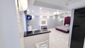 Телевизор и/или развлекательный центр в Apartaments on prospekt Mira 35 (the 95th kvartal, Ploshcha Horkoho)