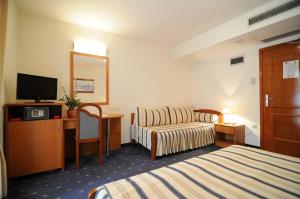 Postel nebo postele na pokoji v ubytování Hotel Rosina