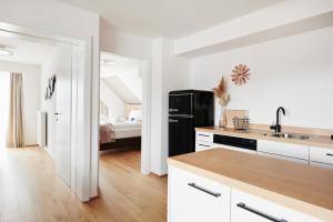 Kuchyň nebo kuchyňský kout v ubytování HOMEBOUND APARTMENTS Salzburg City I - contactless check-in