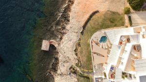 an aerial view of a house next to the ocean at Melian Boutique Hotel & Spa in Pollonia