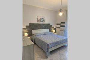 Krevet ili kreveti u jedinici u objektu Casa vacanza - I Mulini con parcheggio gratuito incluso.