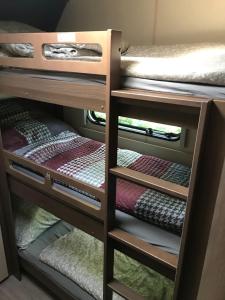 a room with a bunk bed with two bunk beds at Prestige Camping Brandenburg in Plaue