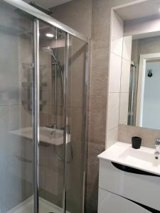 a bathroom with a shower and a sink at A Casinha in Caldas da Rainha