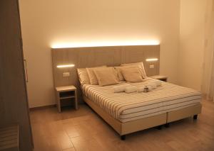 Ліжко або ліжка в номері Arco Dei Sogni
