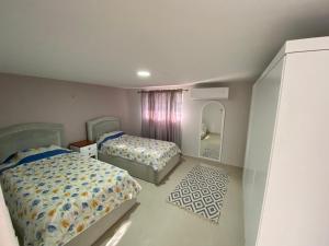 Postel nebo postele na pokoji v ubytování Green Villa