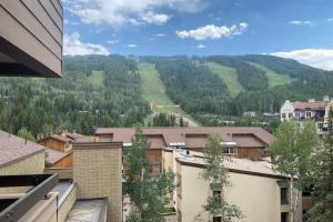 a view of a valley with trees and buildings at Cozy Apartment, Right in front of Lionshead Gondola in Vail