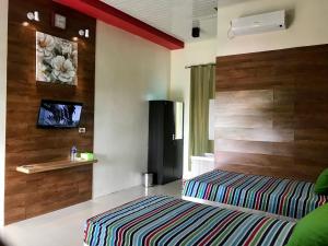 Ένα ή περισσότερα κρεβάτια σε δωμάτιο στο Nuwono Tasya Syariah