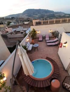 a view of a balcony with a swimming pool at Dar Abdesalam in Fez