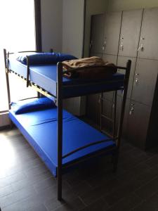 a couple of bunk beds in a room at Albergue Credencial in Sarria