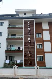 a building with a hotel sign on the side of it at Апартаменты Best Home 26 Cleopatra Legacy No 8 in Alanya