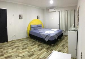 Tempat tidur dalam kamar di Pousada O Mineiro - frente a praia
