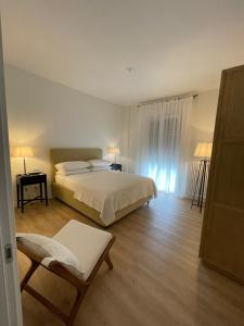 A bed or beds in a room at Magnifica Vittorio Veneto