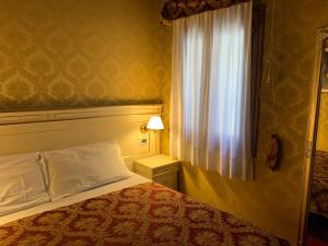 A bed or beds in a room at CASA MARGOT