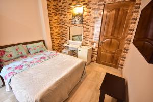 Postel nebo postele na pokoji v ubytování hotel Pharnavaz