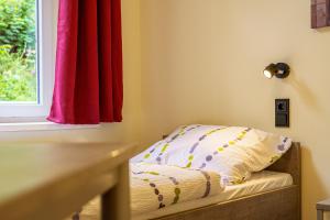 Postel nebo postele na pokoji v ubytování Hotel und Hostel Gleisbett