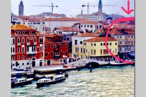 a view of a city with boats in the water at Appartamento con vista Zattere in Venice