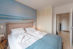 Łóżko lub łóżka w pokoju w obiekcie Mi Casa Holidays Apartamenty Olimpijska O2