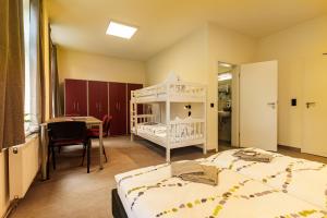 Postel nebo postele na pokoji v ubytování Hotel und Hostel Gleisbett