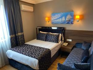 A bed or beds in a room at Star City Hotel