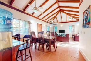 a dining room with a table and chairs at Poseidon House in Riversdale