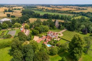 an aerial view of an estate with a mansion at Stylish luxury cottage in historic country estate - Belchamp Hall Coach House in Sudbury