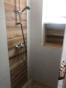 a shower in a bathroom with a glass door at Apartment in the center of the old city, Budžak 14 in Sarajevo