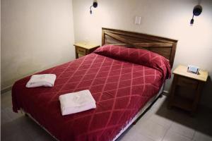 Кровать или кровати в номере El Alamo