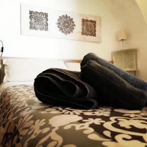 A bed or beds in a room at Trulli Almadè