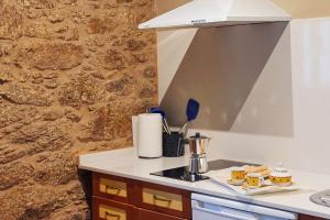 A kitchen or kitchenette at Escola de Bieite